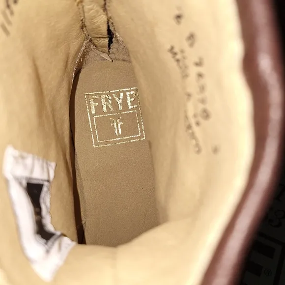 A pair of Frye Phillip Harness dark brown ankle boots in a women's size 6. EUC