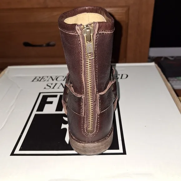 A pair of Frye Phillip Harness dark brown ankle boots in a women's size 6. EUC