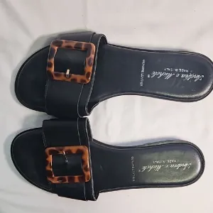 Black Leather Sandals with Tortoise Buckle